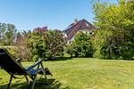 Außenansicht eines Hauses mit Garten - An den Boddenwiesen 02 - Top-Hundeurlaub