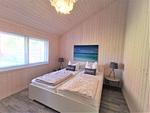 Strandhaus Nr. 10 - Traumurlaub am Großen Plöner See – Seeblick, Sauna & Whirlwanne, Kaminofen, für max. 8 Pers. - Top-Hundeurlaub