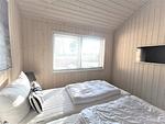 Strandhaus Nr. 10 - Traumurlaub am Großen Plöner See – Seeblick, Sauna & Whirlwanne, Kaminofen, für max. 8 Pers. - Top-Hundeurlaub