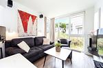 Wohnzimmer mit Sofa - Wohnung 01 - Top-Hundeurlaub