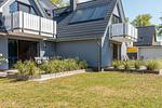 Außenansicht eines Ferienhauses mit Balkon - Haus Ostseenixe 03 - Top-Hundeurlaub