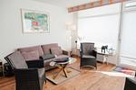 Gemütliches Wohnzimmer mit Sofa und Sesseln - Berliner Hof App. 301 - Top-Hundeurlaub
