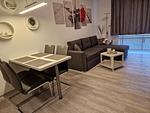 Gemütliches Wohnzimmer mit Esstisch und Sofa - Nautica App A6, Strandallee 65 Haffkrug - Top-Hundeurlaub