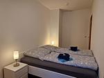 Entspannen Sie in diesem einladenden Schlafzimmer mit stilvollem Design. - Berliner Hof App. 115 - Top-Hundeurlaub