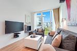 Wohnzimmer mit Sofa und Sessel - Wohnung 07 - Top-Hundeurlaub