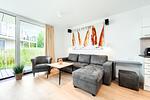 Wohnzimmer mit Couch - Wohnung 01 - Top-Hundeurlaub