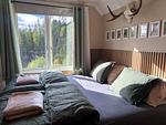 Gemütliches Doppelbett im Schlafzimmer des Häxans Hus - Häxans Hus - Top-Hundeurlaub